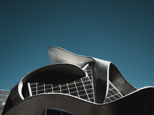 House with distinct archtiecture with blue sky as background. Full-service marketing agencies