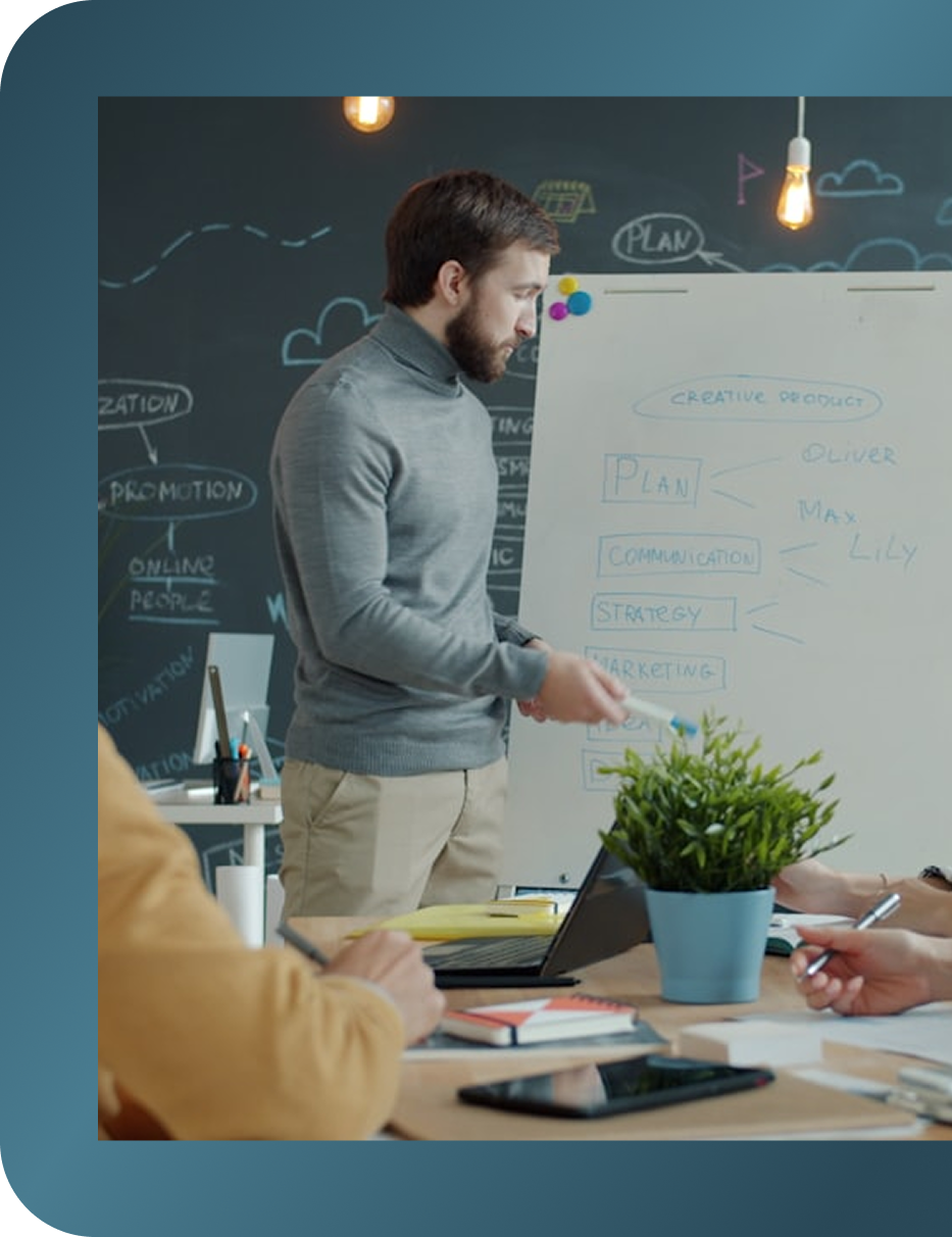 Marketeer staring as whiteboard. Full-service marketing agency